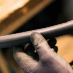 Guy holding an industrial hose used in Malaysia