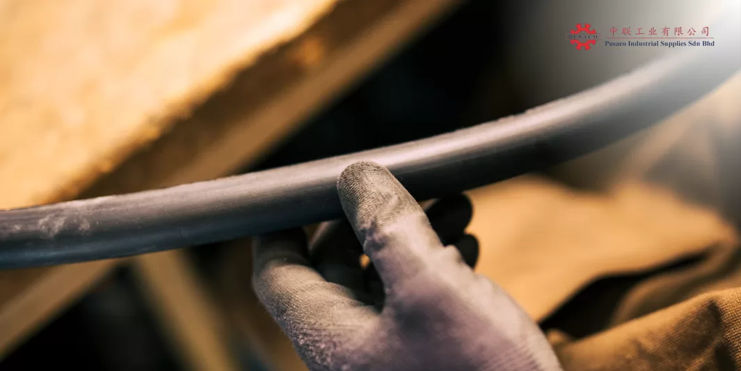 Guy holding an industrial hose used in Malaysia